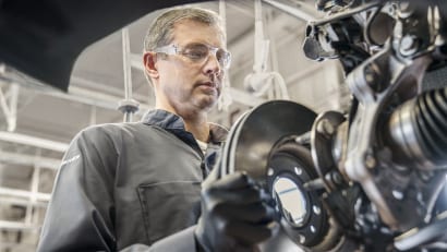 GM technician installing a brake disk